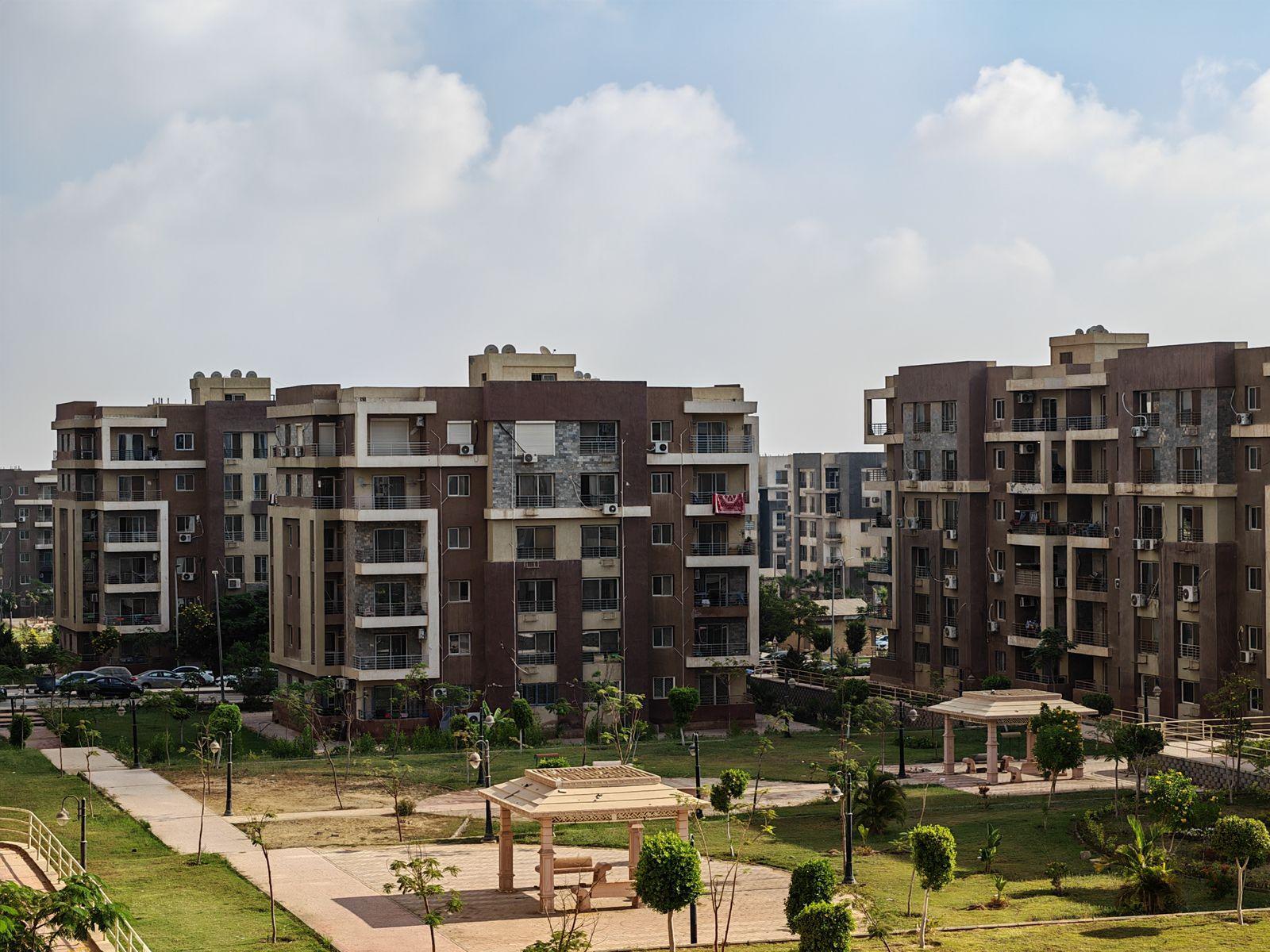 Apartment complex with landscaped lawns and walkways